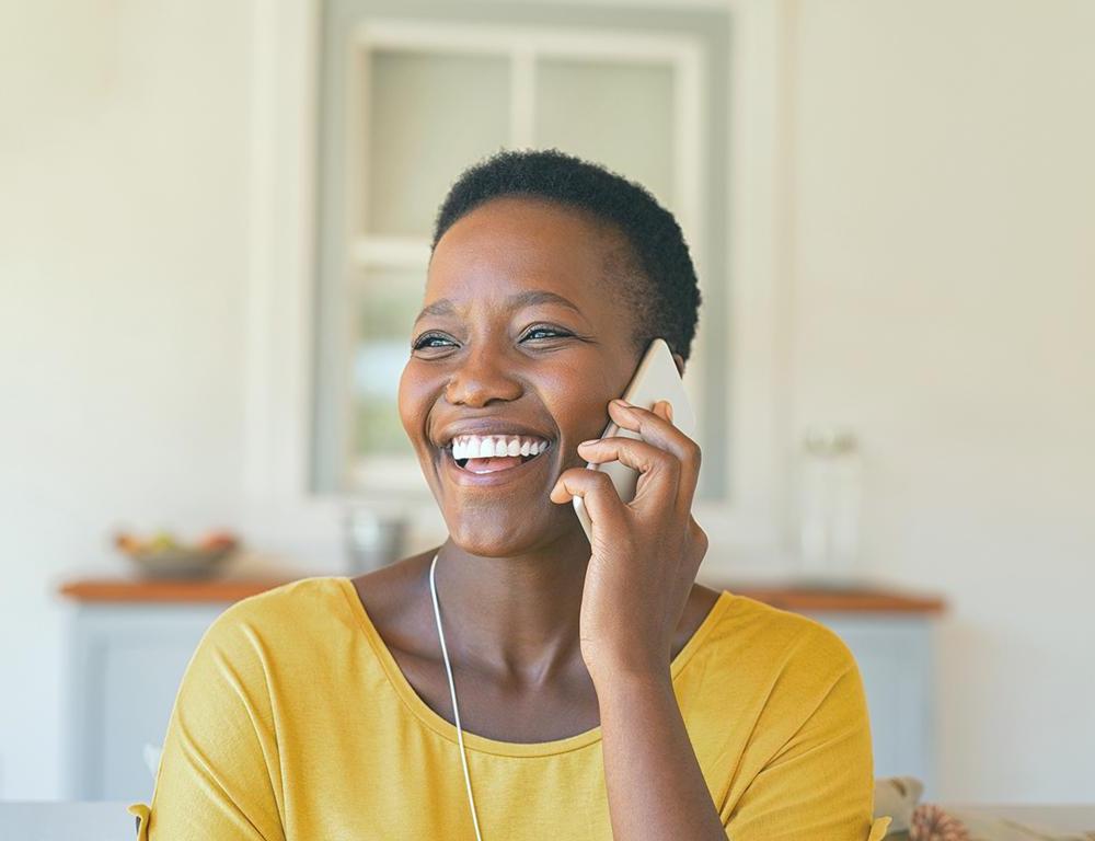 woman smiling on phone